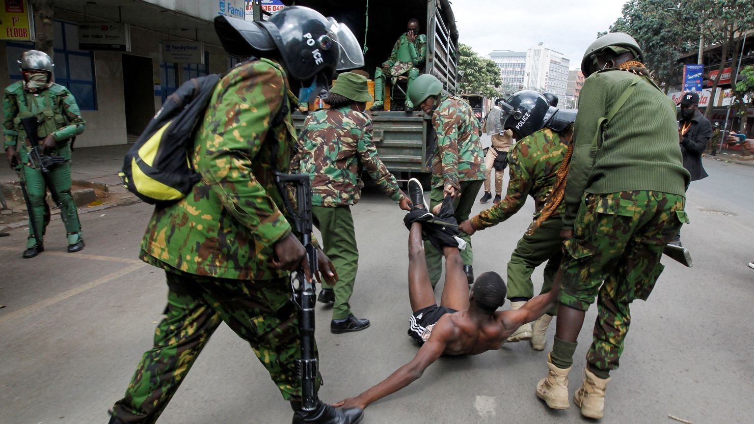 Police officers detain a man during a demonstration over police killings of people protesting against Kenya's finance bill, in Nairobi, Kenya, on June 27, 2024.