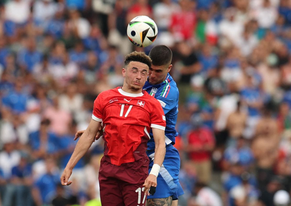  Vargas vies for the ball with Italy's Gianluca Mancini.