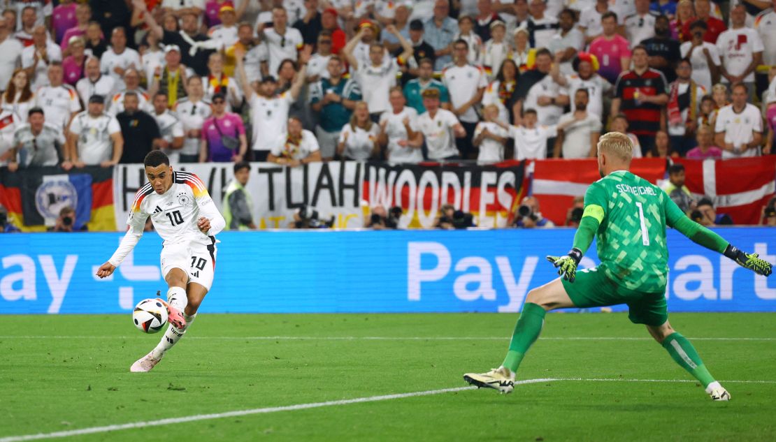 Musiala slots home his third goal of Euro 2024 - the 21-year-old is now the tournament's joint-top goalscorer with Georgia's Georges Mikautadze. Thilo Schmuelgen/Reuters