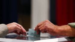 A voter casts their ballot, during the first round of the early French parliamentary elections at a polling station in Le Touquet-Paris-Plage, France, June 30, 2024.