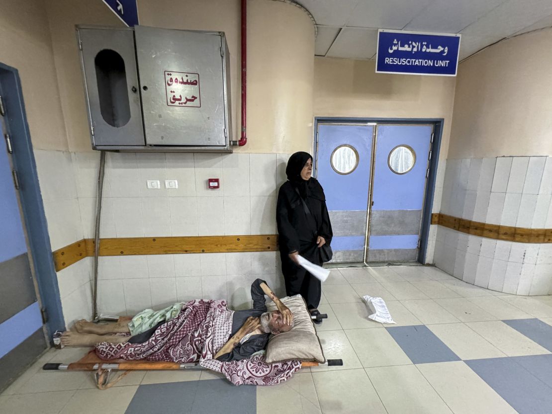 A wounded Palestinian man, who was evacuated from the European Hospital after the Israel army ordered Palestinians to evacuate the eastern part of Khan Younis, lies on a stretcher on the floor at Nasser Hospital, in the southern Gaza Strip on July 2.