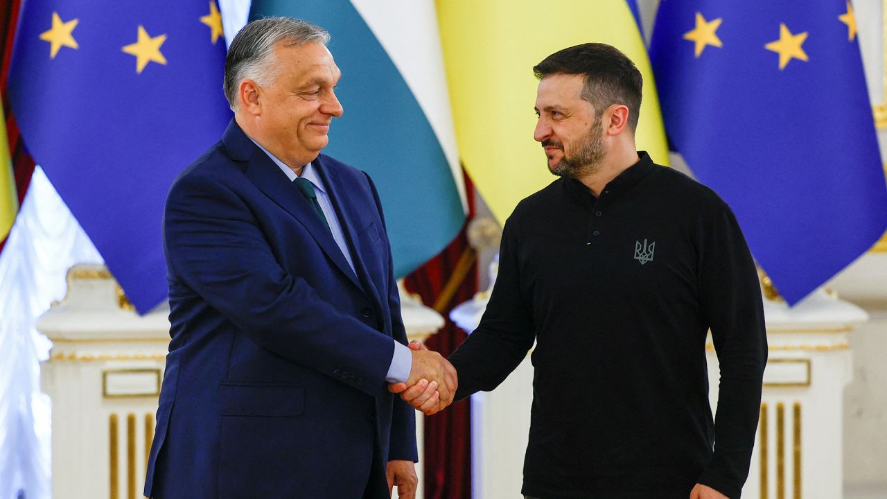 Hungary's Prime Minister Viktor Orban and Ukrainian President Volodymyr Zelensky shake hands before their meeting in Kyiv on July 2, 2024.