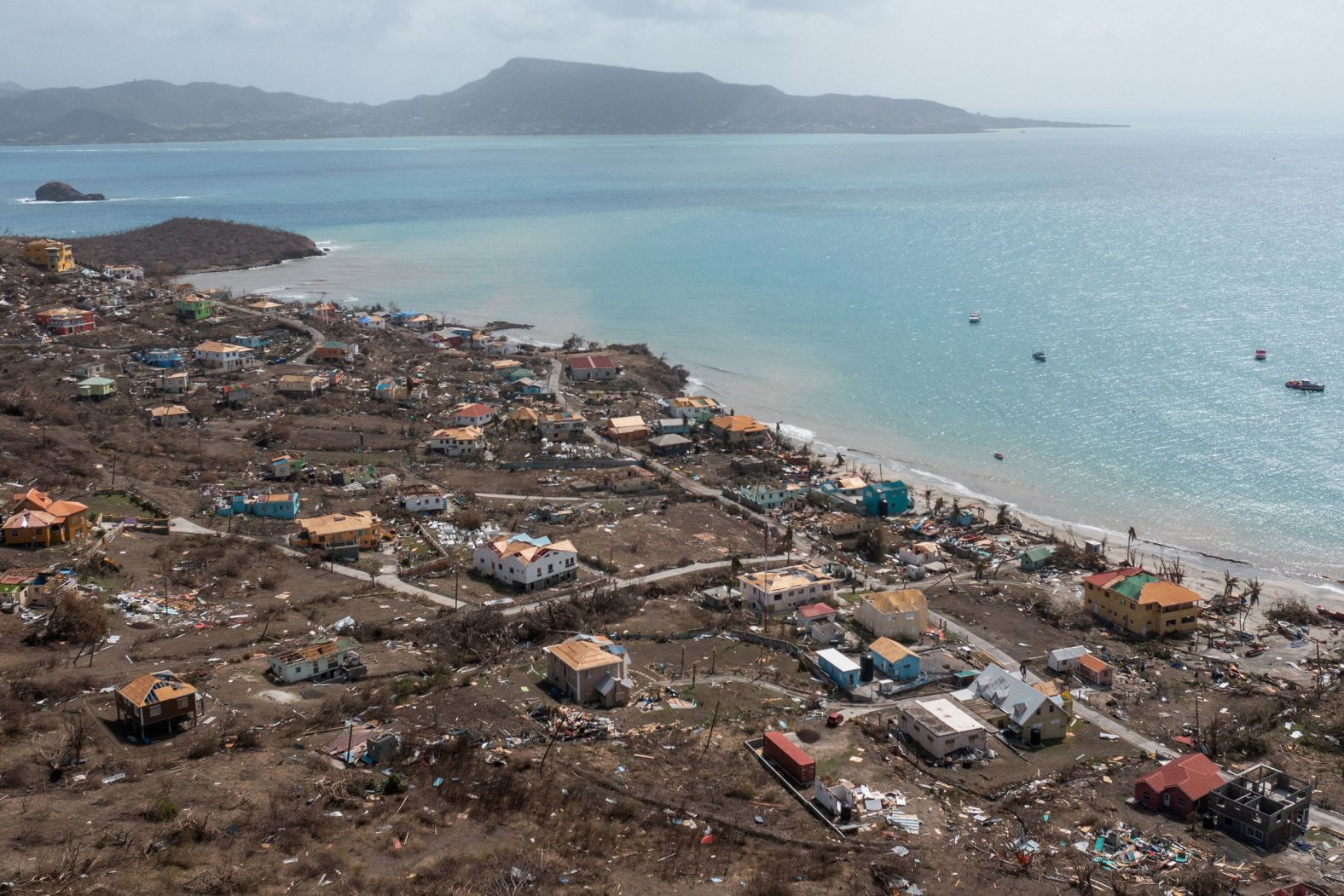 Homes are damaged on the island of Petite Martinique on July 2.