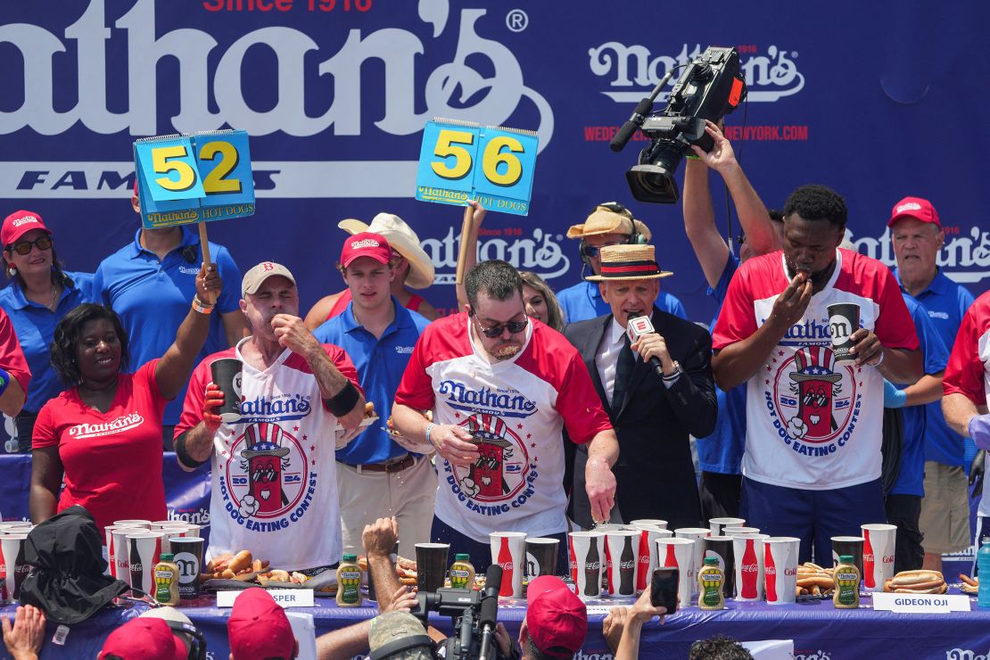 Patrick Bertoletti won the men's contest after chomping on 58 hot dogs and buns.