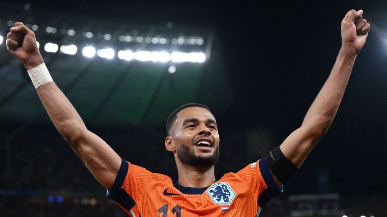 Cody Gakpo celebrates after the Netherlands beat Turkey at Euro 2024.
