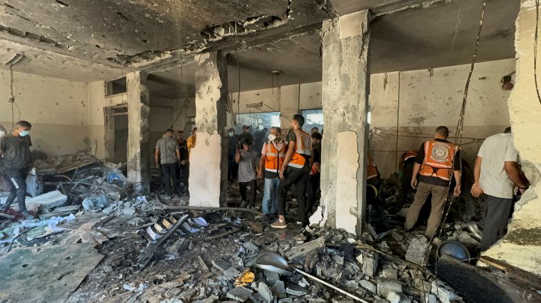 Palestinians inspect the Holy Family School which shelters displaced people, after it was hit in an Israeli strike, amid Israel-Hamas conflict, in Gaza City, July 7, 2024.