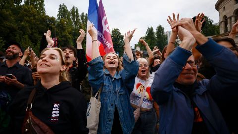 Supporters of French far-left opposition party La France Insoumise (France Unbowed - LFI) react after partial results in the second round of the early French parliamentary elections at Place Stalingrad in Paris, France, July 7, 2024. REUTERS/Yara Nardi