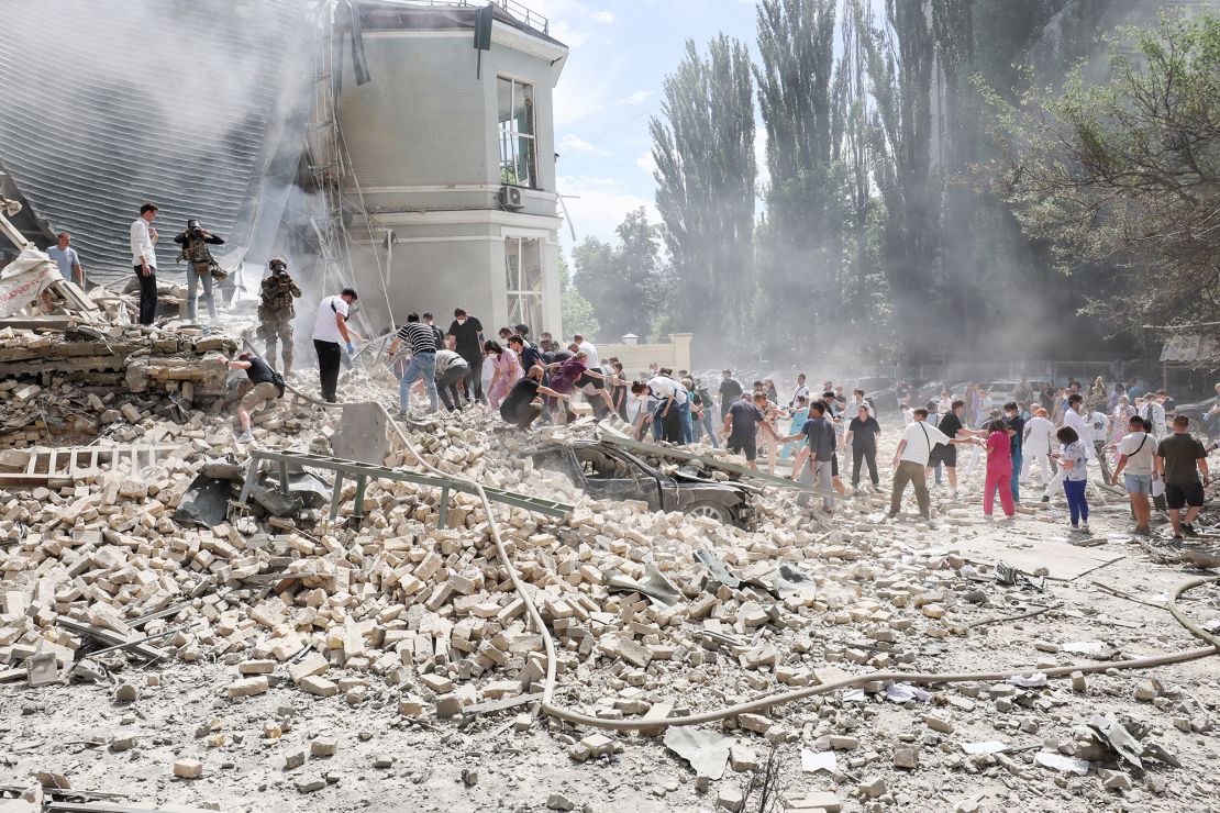 Medical personnel and members of the public quickly formed lines to clear rubble from the destroyed areas of the hospital and search for survivors.