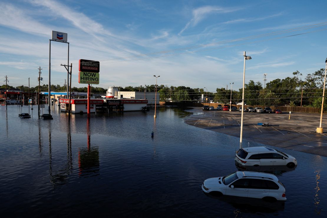 Cars and buildings are partially submerged in floodwaters in the aftermath of Hurricane Beryl in Houston on July 8, 2024.