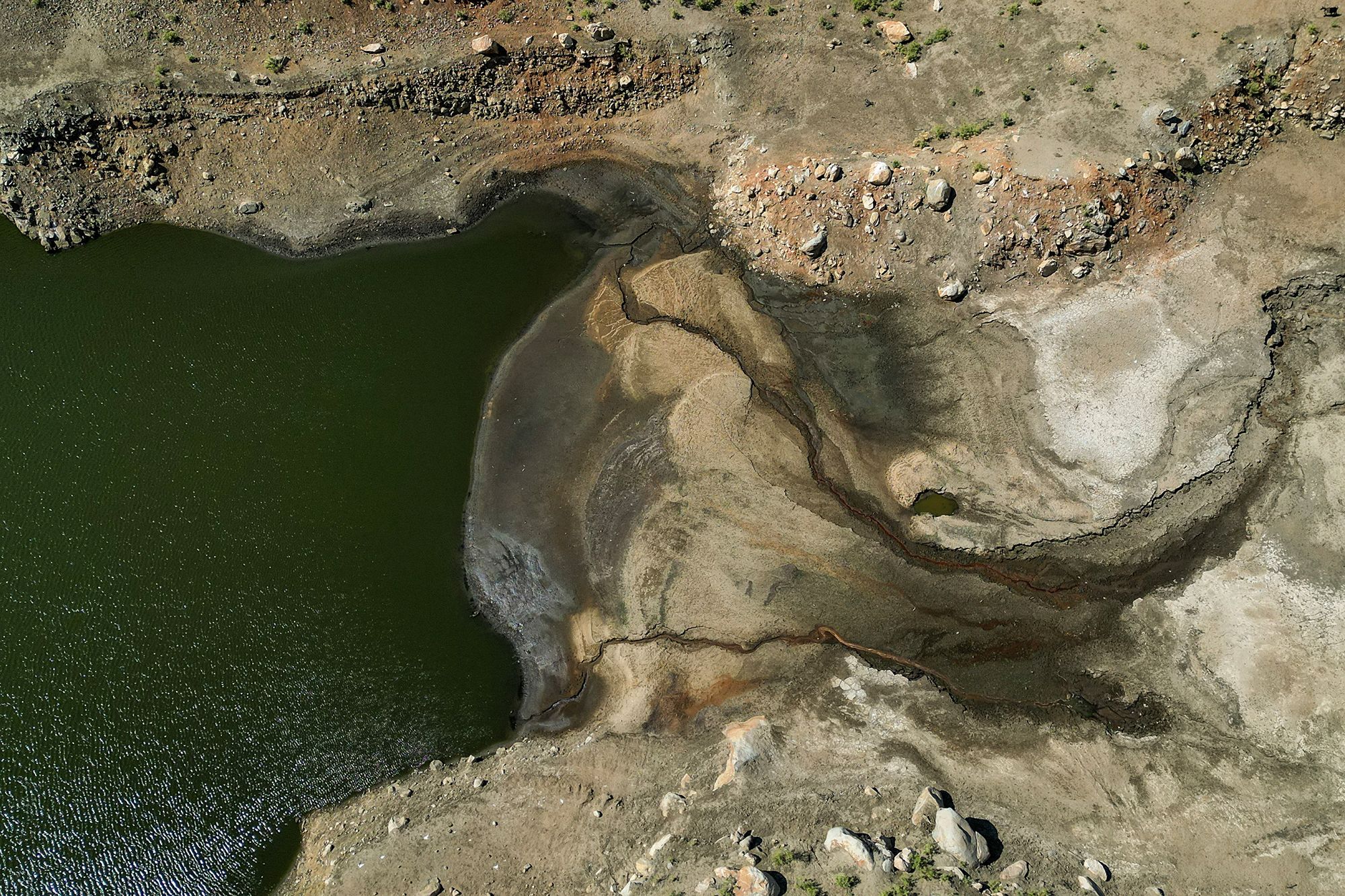 Part of the Eggares irrigation dam, on Naxos, Greece on June 20, 2024. The island is struggling with low water supplies as a lack of rainfall dries up its reservoirs.