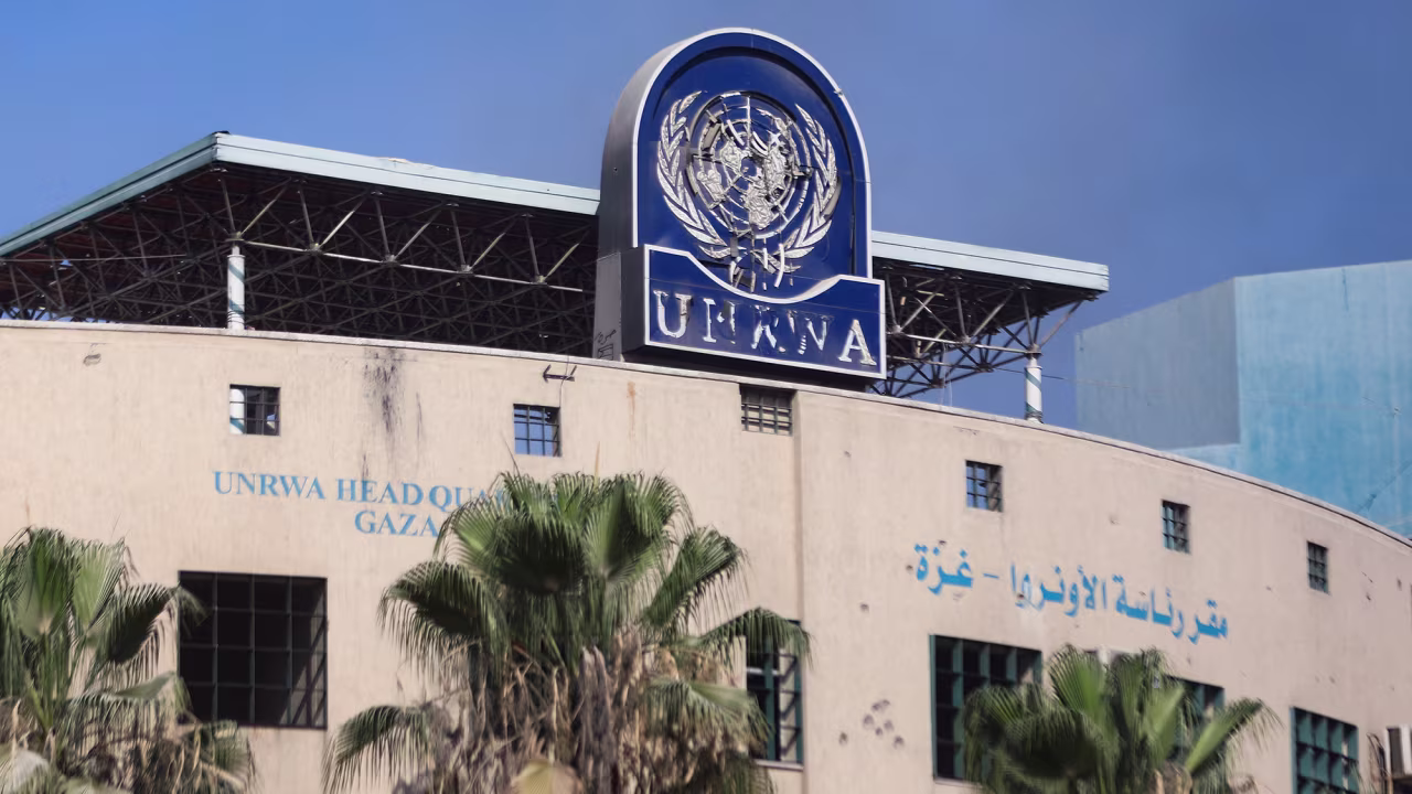 A damaged sign is pictured at the headquarters of UNRWA, following an Israeli raid, in Gaza City, on July 12.