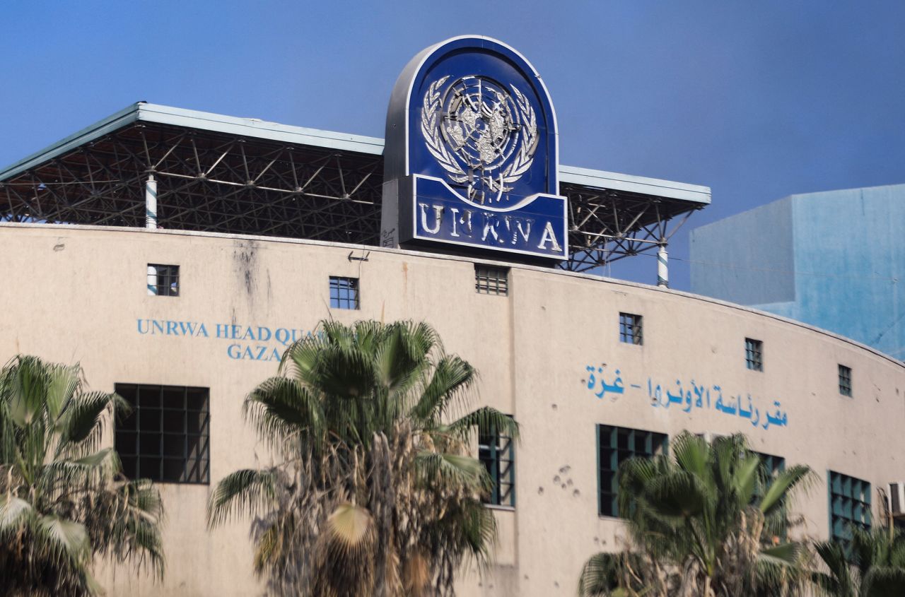 A damaged sign is pictured at the headquarters of UNRWA in Gaza City on July 12.