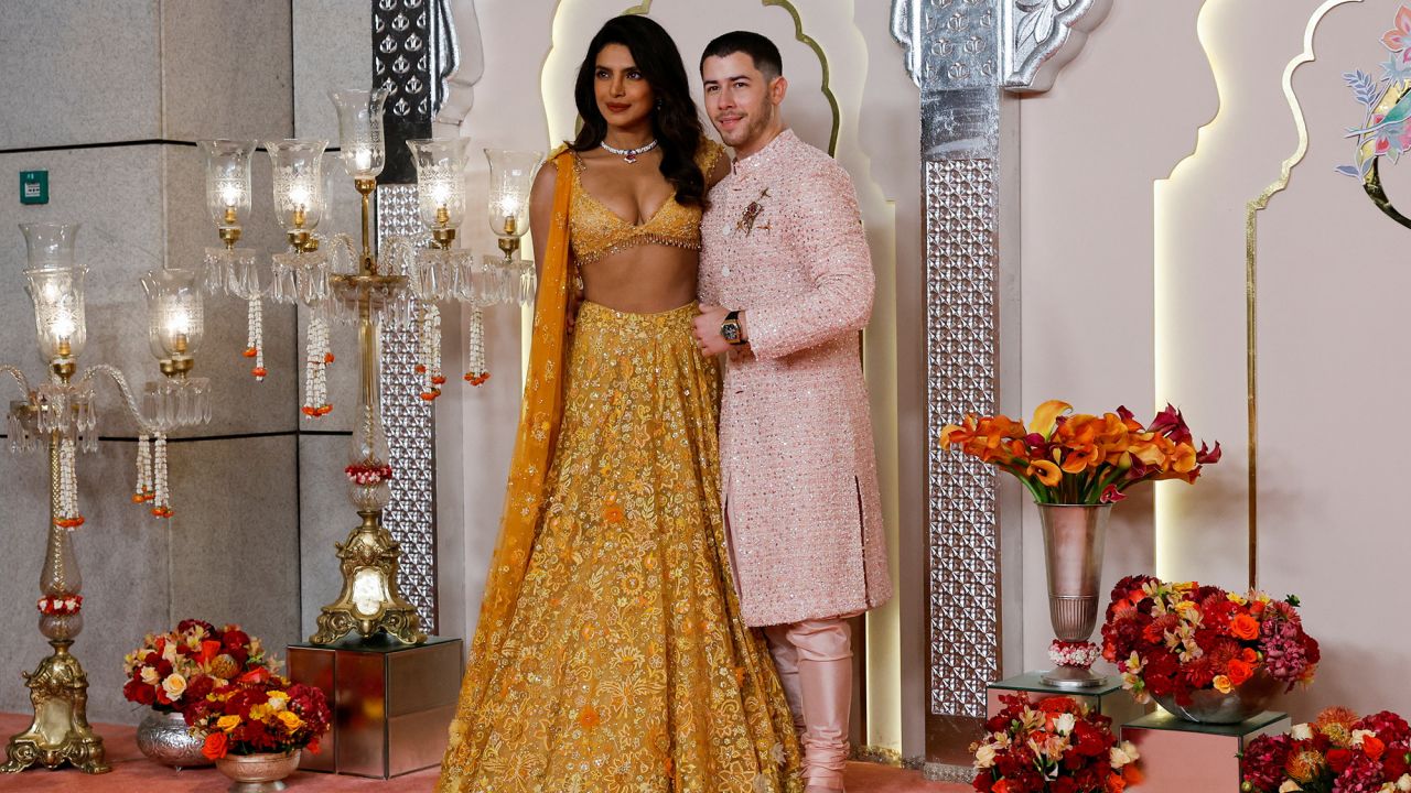 Nick Jonas and Priyanka Chopra pose for pictures on the red carpet on the day of the wedding of Anant Ambani and Radhika Merchant in Mumbai, India, July 12, 2024. REUTERS/Francis Mascarenhas