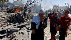 Palestinians react near damages, following what Palestinians say was an Israeli strike at a tent camp in Al-Mawasi area, amid Israel-Hamas conflict, in Khan Younis in the southern Gaza Strip July 13, 2024.
