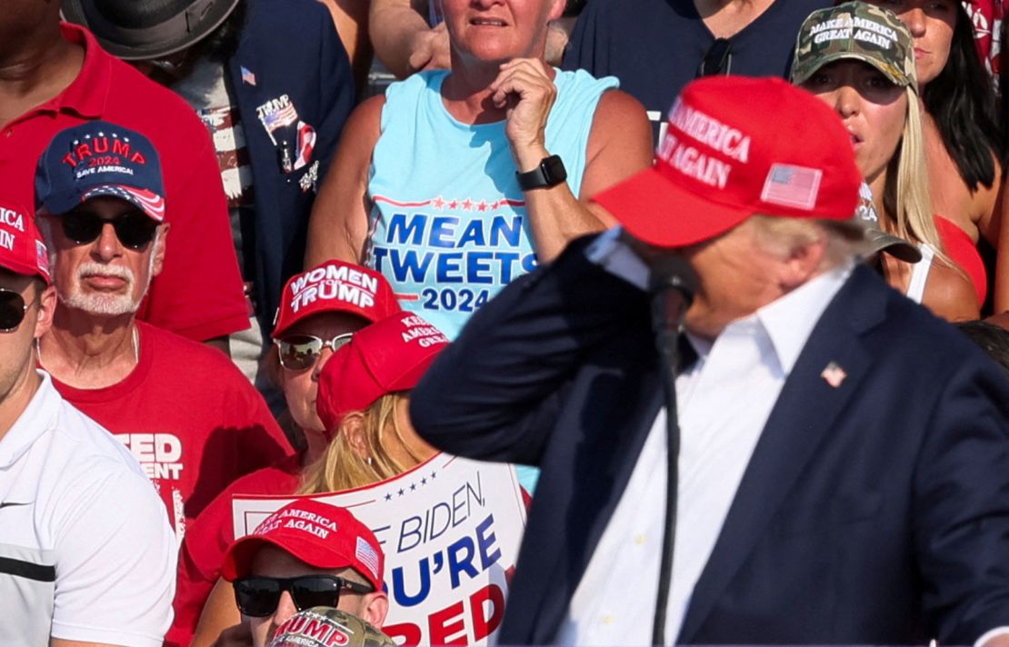 Former President Donald Trump reacts as multiple shots rang out during a campaign rally in Butler, Pennsylvania, on Saturday, July 13.