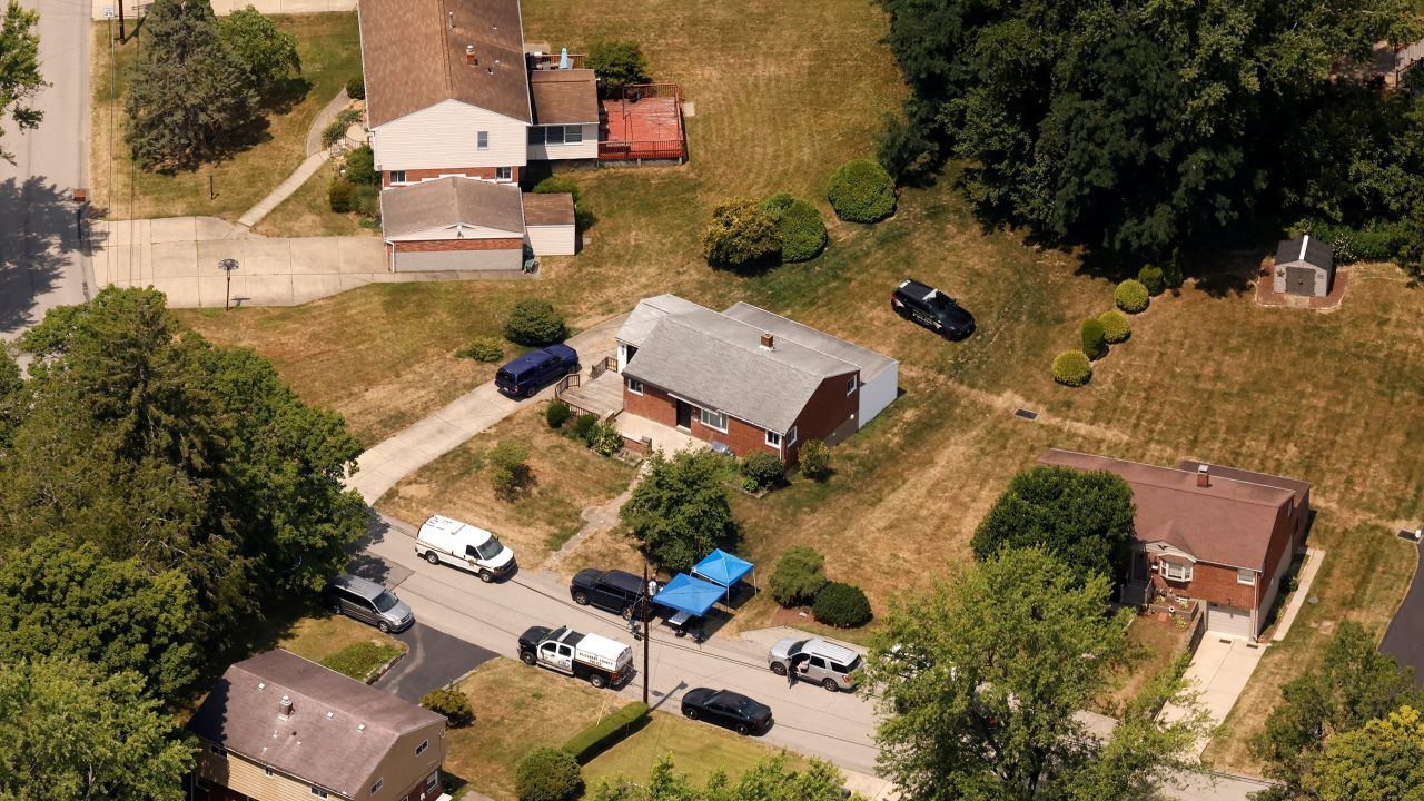 An aerial view shows law enforcement members at the home of 20-year-old Thomas Matthew Crooks, named by the FBI as the "subject involved" in the attempted assassination of former U.S. President Donald Trump, in Bethel Park, Pennsylvania, U.S. July 14, 2024.