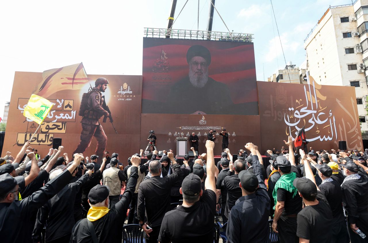 Lebanon's Hezbollah leader Hassan Nasrallah appears on a screen as he addresses supporters in Beirut, Lebanon, on July 17.