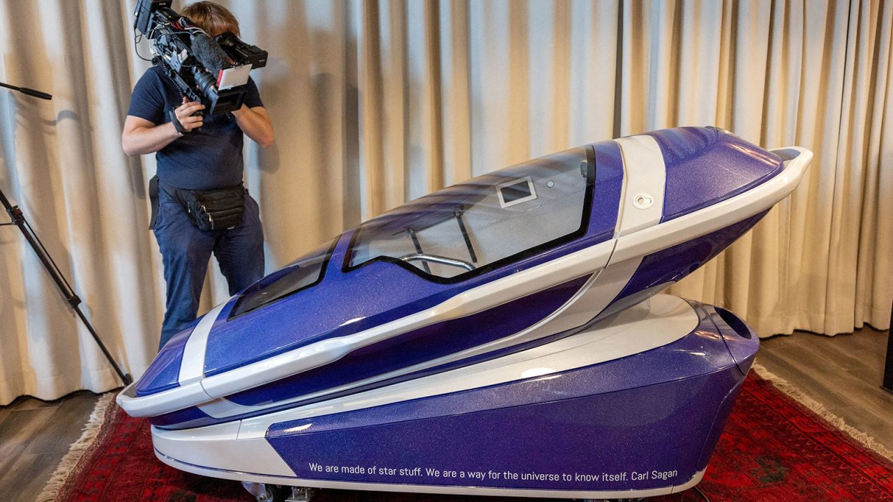 A person records the Sarco suicide machine, a 3D-printed capsule that gives the user the ultimate control over the timing of her/his death, created by Australian euthanasia advocate Philip Nitschke, during a presentation by The Last Resort in Zurich, Switzerland, July 17, 2024. REUTERS/Denis Balibouse
     TPX IMAGES OF THE DAY     