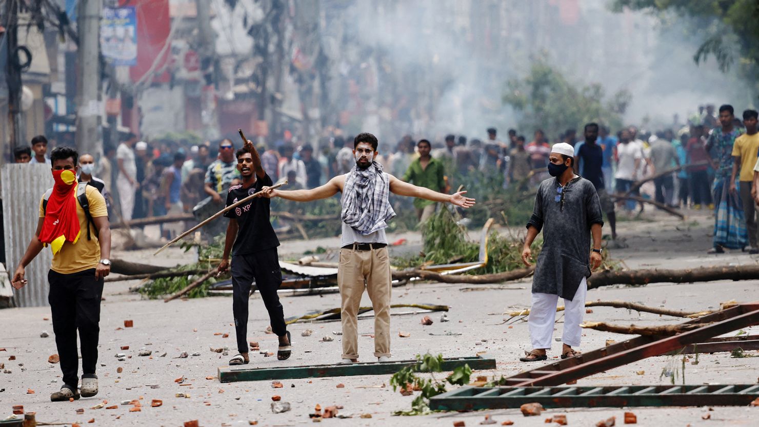 Protesters clash with Border Guard Bangladesh (BGB) and the police outside the state-owned Bangladesh Television in Dhaka, Bangladesh, July 19, 2024.