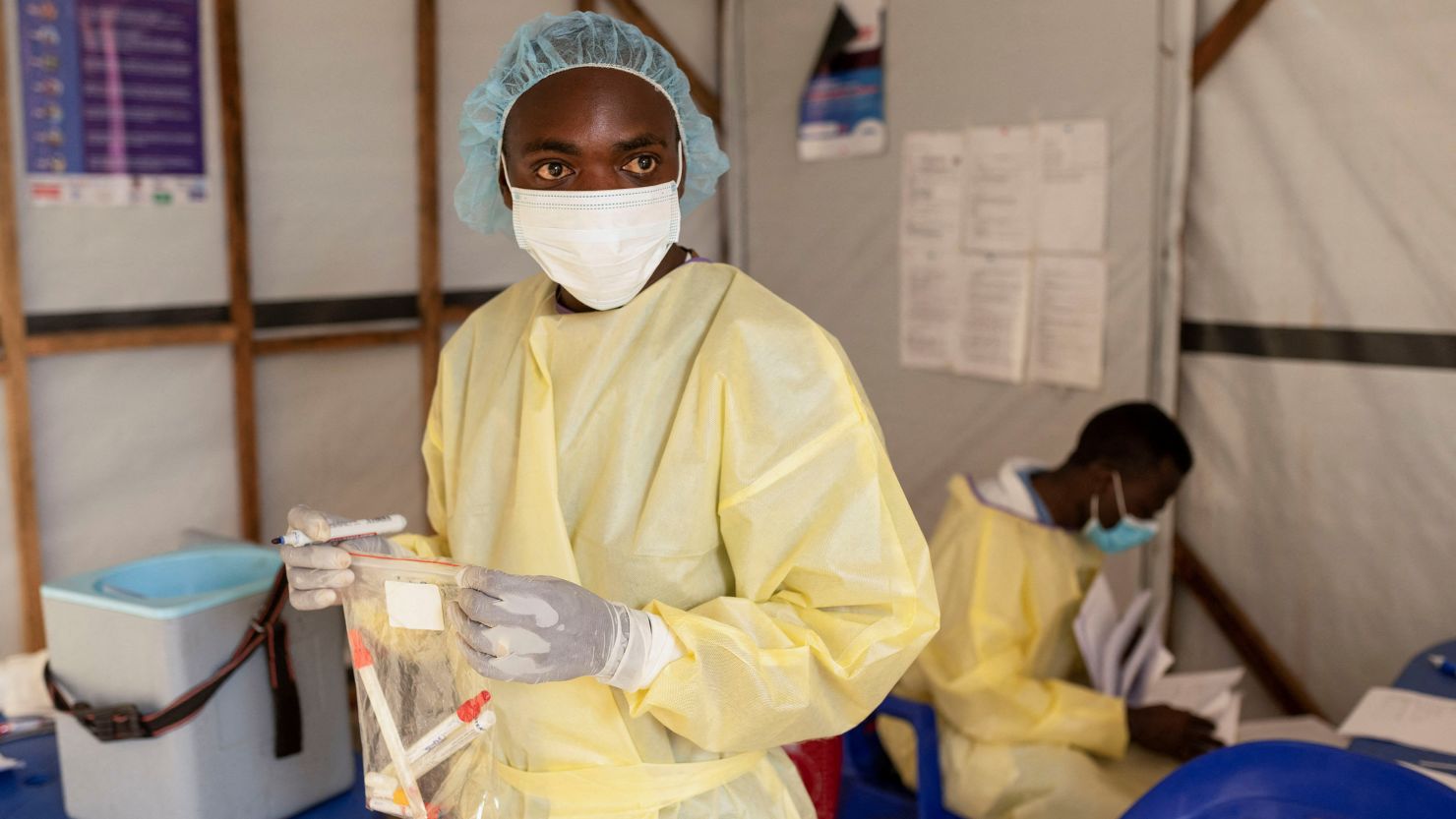 Christian Musema, a laboratory nurse, verifies samples taken from a child declared a suspected case of monkeypox virus that sparks off a painful rash, enlarged lymph nodes and fever; and recovered, collects water at the the treatment centre in Munigi, following Mpox cases in Nyiragongo territory near Goma, North Kivu province, Democratic Republic of the Congo July 19, 2024. REUTERS/Arlette Bashizi