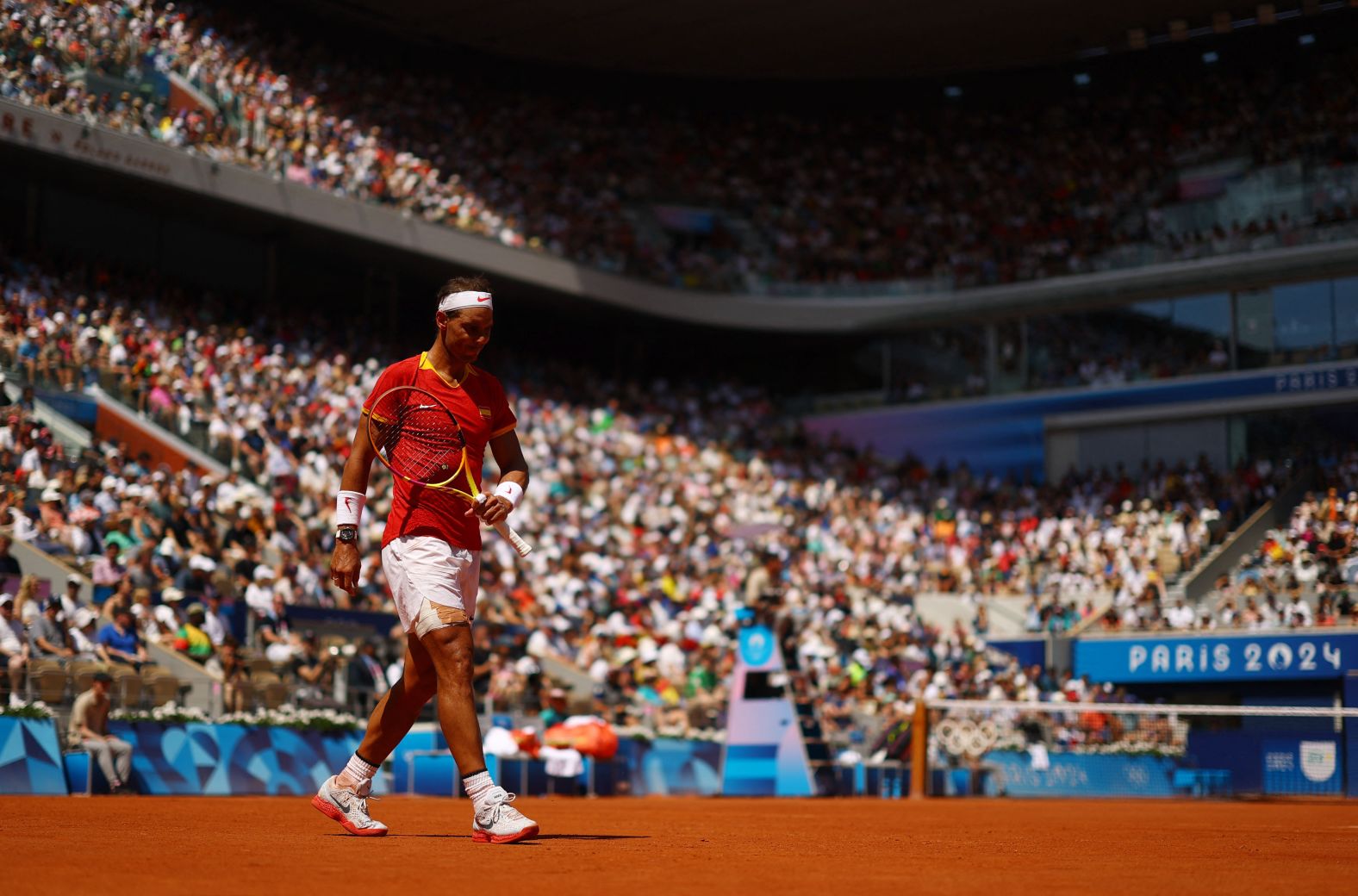 Spain's Rafael Nadal reacts while playing Serbia's Novak Djokovic in a second-round match on July 29. Djokovic defeated his longtime rival in an <a >epic showdown</a>, winning 6-1, 6-4.