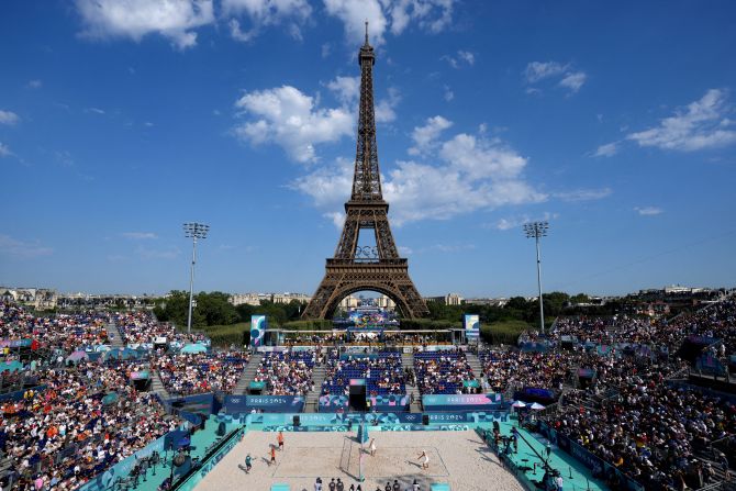 The Eiffel Tower overlooks a beach volleyball match on July 29.