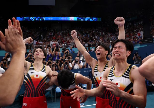 Japanese gymnasts celebrate after they won gold in the team competition on July 29. The Chinese team was in first place heading into the final rotation, but <a href="https://www.cnn.com/sport/live-news/paris-olympics-news-2024-07-29#h_1d07bdf444f6d54879d7e0119876b3b4">some costly mistakes on the horizontal bar</a> dropped it to second place. The United States won the bronze.