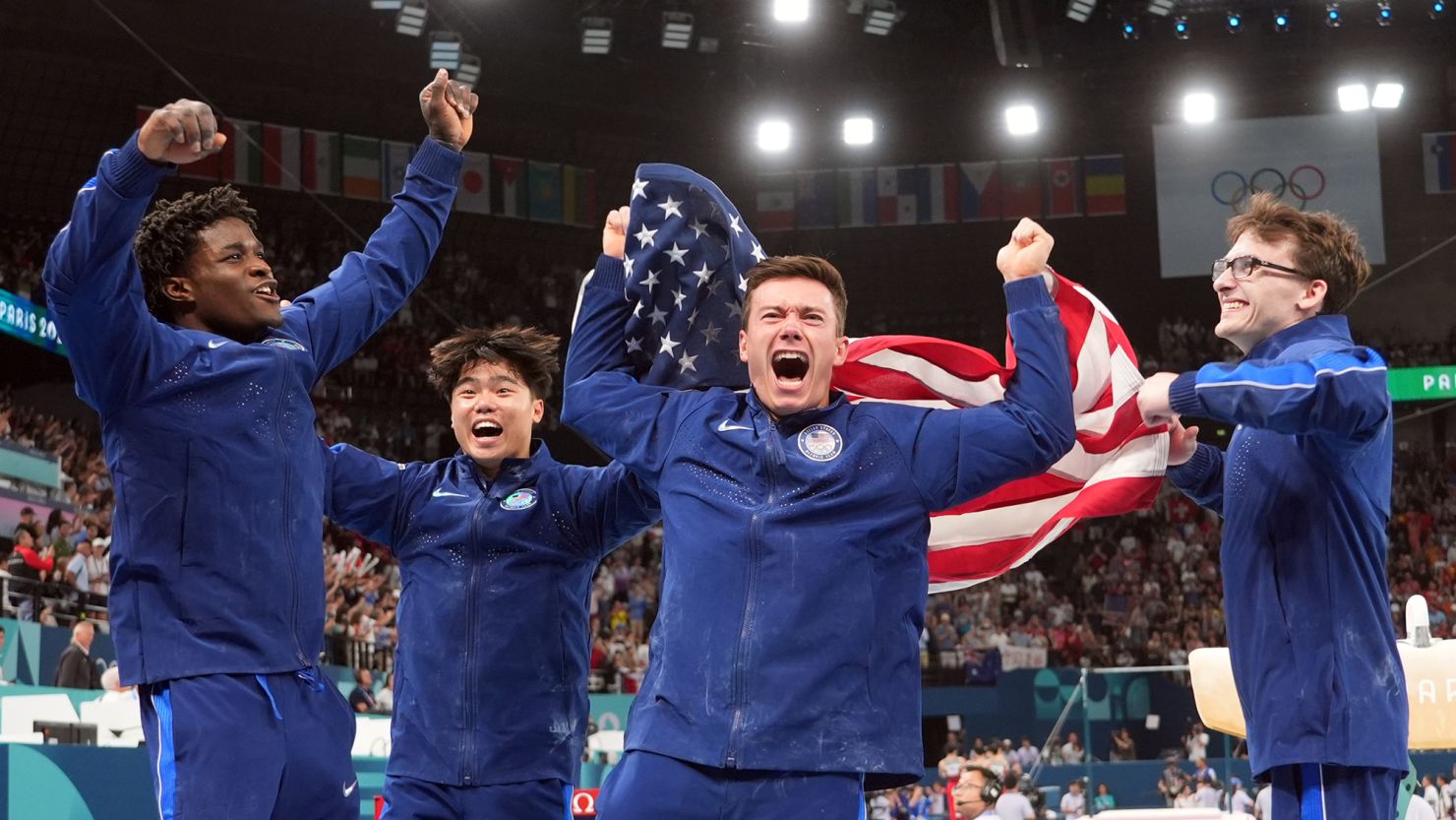 Team USA's Frederick Richard, Asher Hong, Brody Malone and Stephen Nedoroscik celebrate after winning bronze during the men’s team final at Bercy Arena on July 29 in Paris.