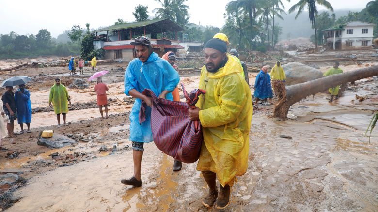Rescuers carry the body of a victim at the landslide site after multiple landslides in the hills, in Wayanad, in the southern state of Kerala, India, July 30, 2024.