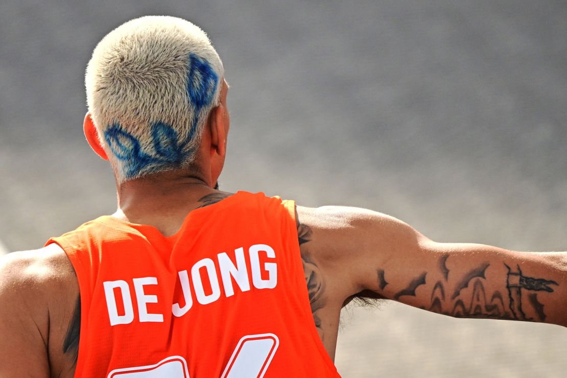 Olympic basketball player Worthy de Jong of Team Netherlands decided to switch up his look with a blue dyed flower painted across his bleached buzz cut.