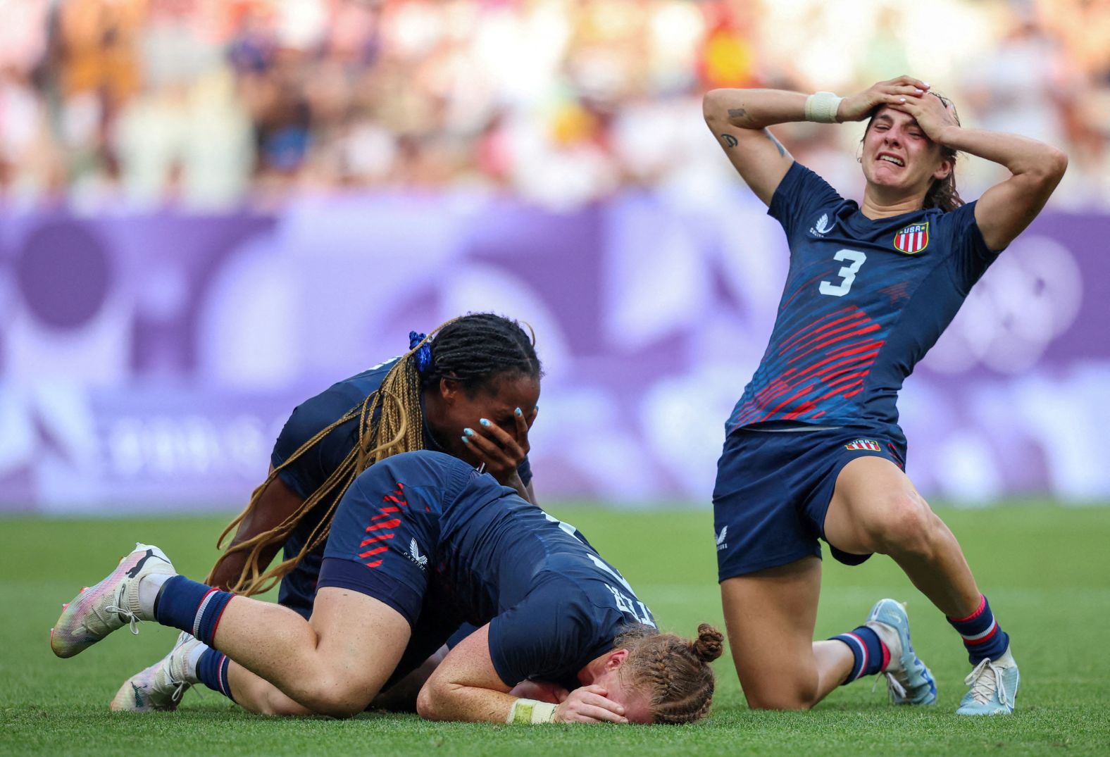 The United States' Naya Tapper, Alev Kelter and Kayla Canett celebrate after their team finished a <a >stunning comeback to defeat Australia</a> and win bronze in rugby sevens on July 30. It is the the United States' first-ever Olympic medal in the sport — for either men or women.