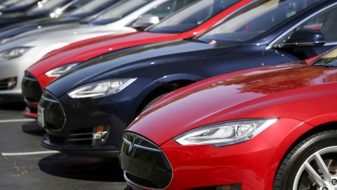 FILE PHOTO: A row of Tesla Model S sedans are seen outside the company's headquarters in Palo Alto, California April 30, 2015. REUTERS/Elijah Nouvelage/File Photo