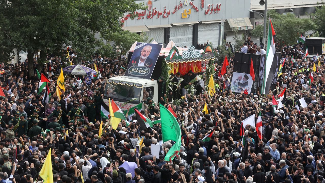 Iranians attend the funeral procession of assassinated Hamas political chief Ismail Haniyeh in Tehran, Iran, August 1, 2024.