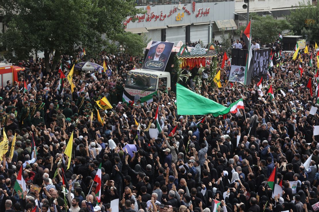 Iranians attend the funeral procession of assassinated Hamas political chief Ismail Haniyeh in Tehran, Iran, August 1, 2024.