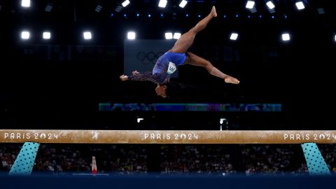 Simone Biles performs on the balance beam during the individual all-around competition at the Paris Olympics on Thursday, August 1.