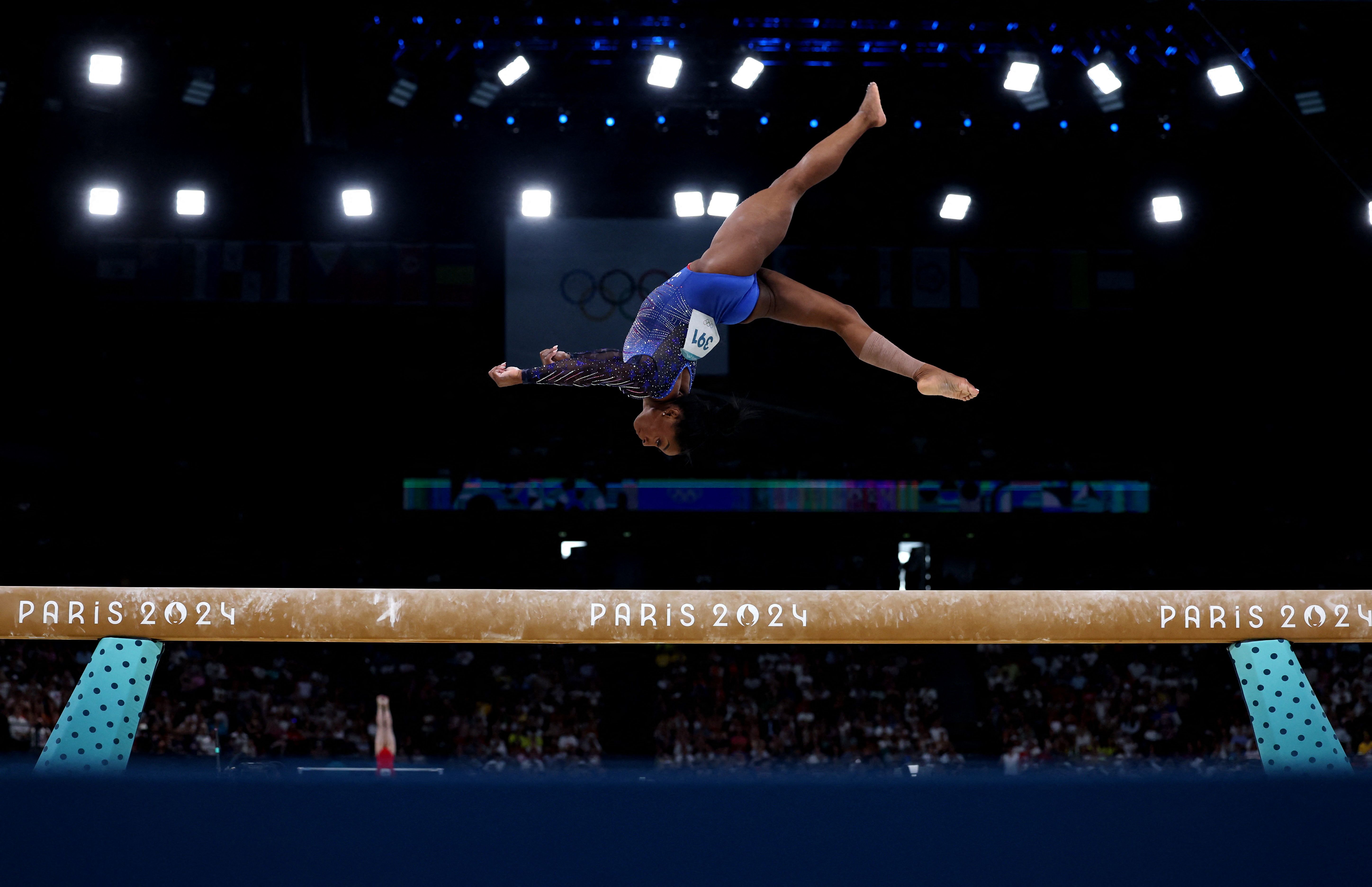 US gymnast Simone Biles competes on the balance beam during the individual all-around on Thursday, August 1. <a href="https://www.cnn.com/2024/08/01/sport/gallery/simone-biles-olympic-all-around">She won the gold</a>, completing her comeback story and regaining her title from 2016.