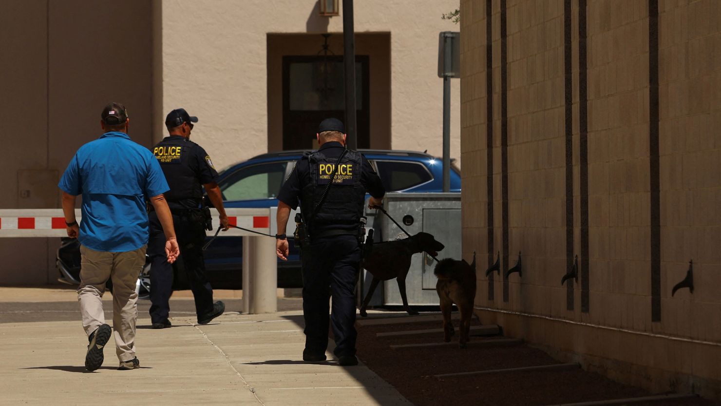 Police officers with K-9 dogs walk outside US federal court where alleged Mexican drug kingpin Ismael "El Mayo" Zambada appeared on drug trafficking charges in El Paso, Texas, August 1, 2024.