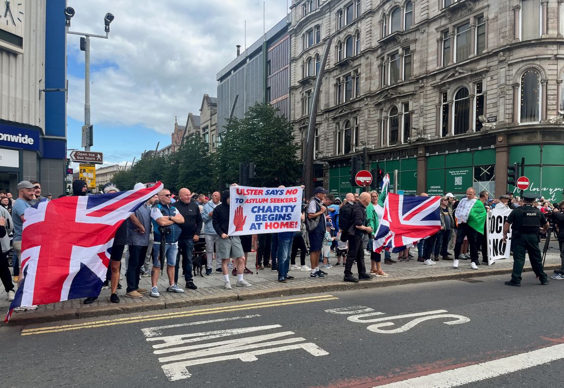 Demonstrators hold banners and flags during a protest in Belfast, Northern Ireland, on Saturday.