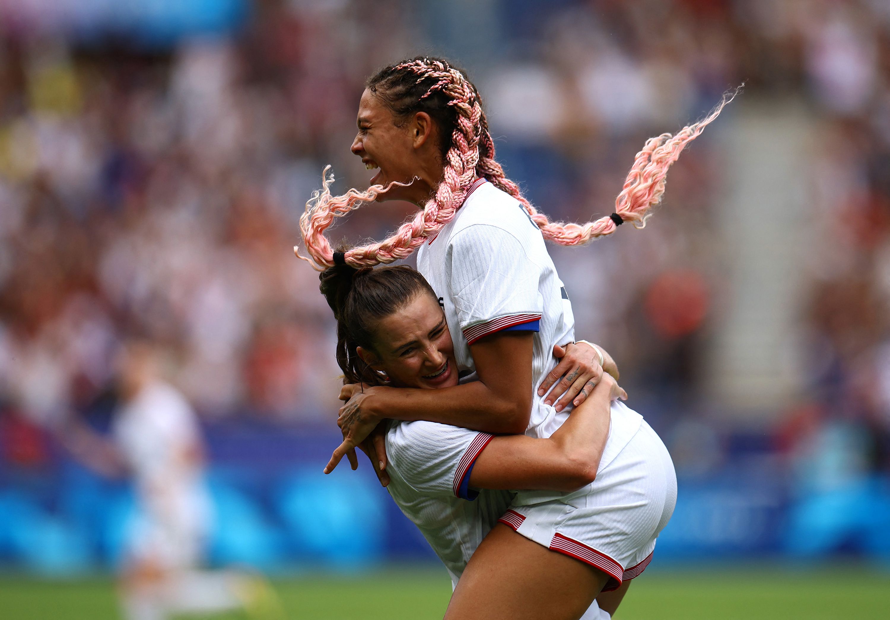 US forward Trinity Rodman, right, celebrates with teammate Emily Fox after scoring a goal against Japan on August 3. The Americans needed extra time to win 1-0 and <a href="https://www.cnn.com/sport/live-news/paris-olympics-news-2024-08-03#h_8e0bb6ea63316728231cf3ccd5032466">advance to the semifinals</a>.