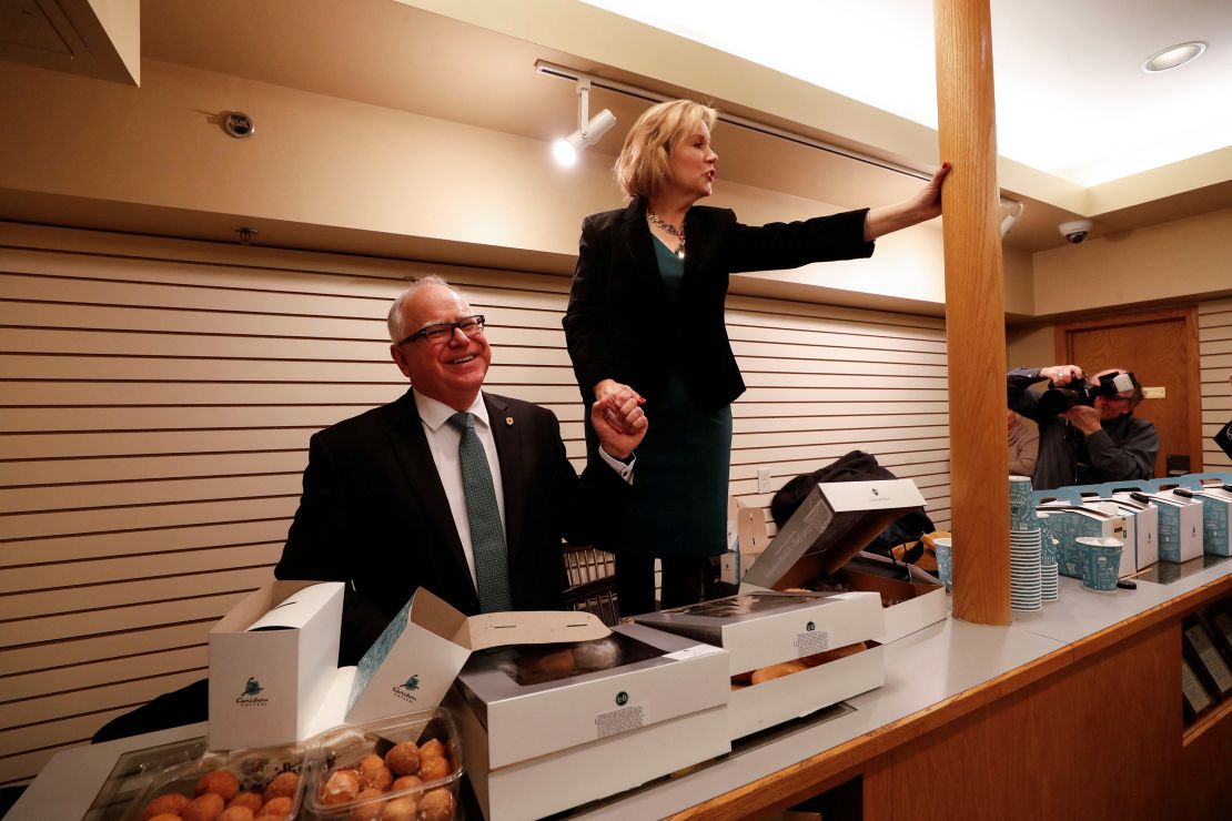 Minnesota Governor Tim Walz laughs as his wife, Gwen, speaks to a room full of fellow school teachers before the governor's inauguration at the Fitzgerald Theater in St. Paul, Minnesota, U.S., January 7, 2019. REUTERS/Eric Miller