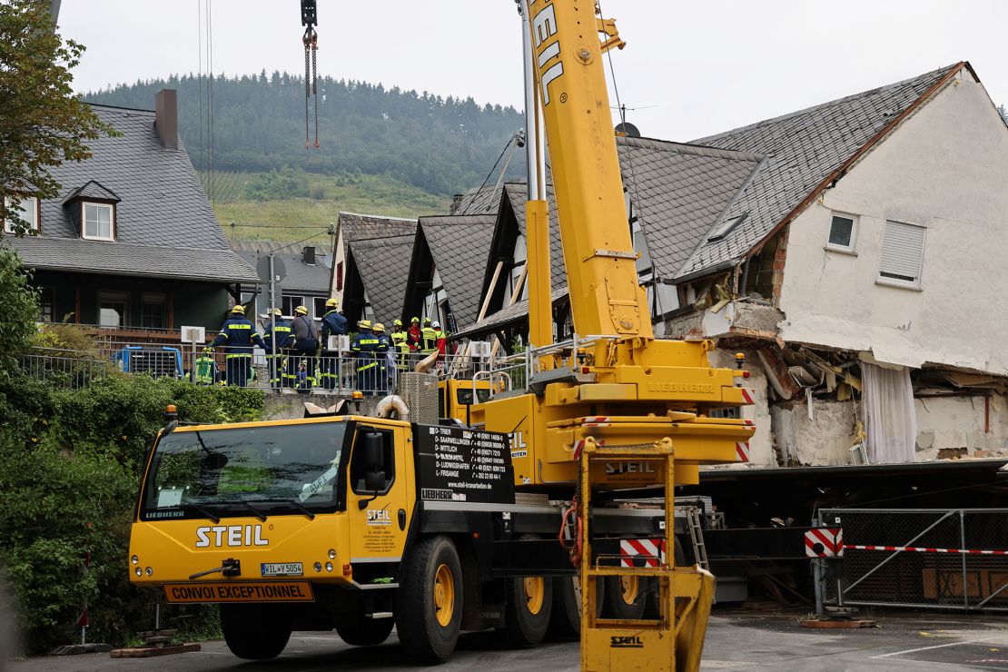 A crane is set up after a hotel partially collapsed overnight.