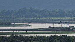 People are seen in Myanmar's Maungdaw township from the Teknaf area of Bangladesh, at the Myanmar-Bangladesh border on June 27, 2024.