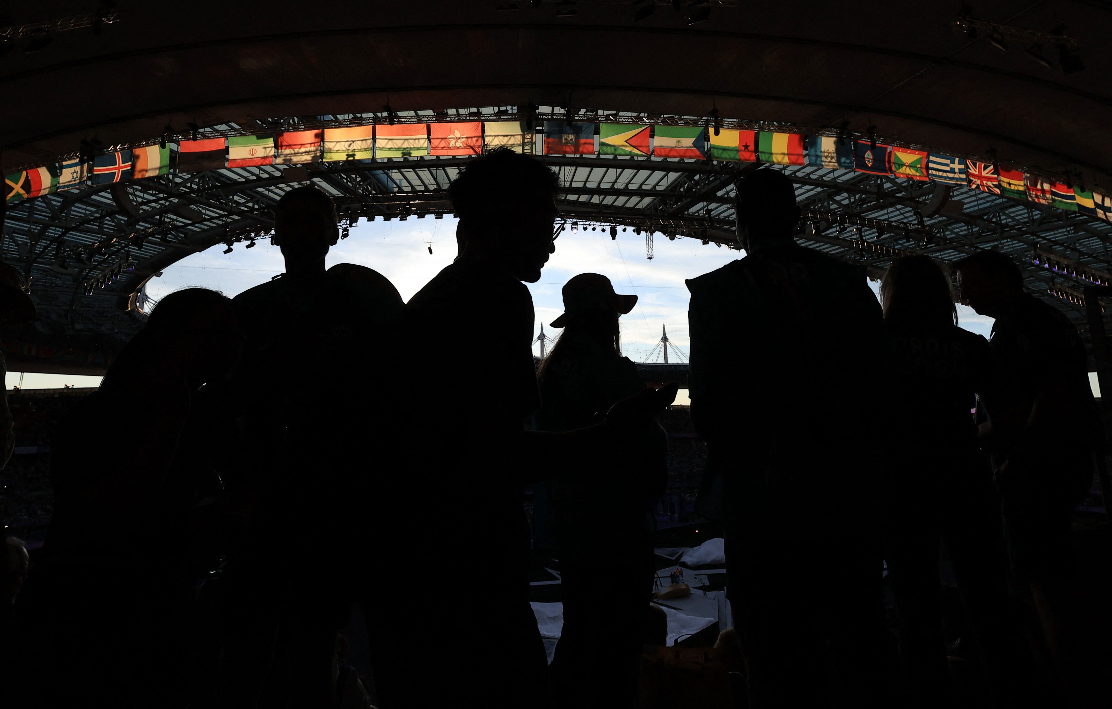 Volunteers work inside the stadium ahead of the closing ceremony.