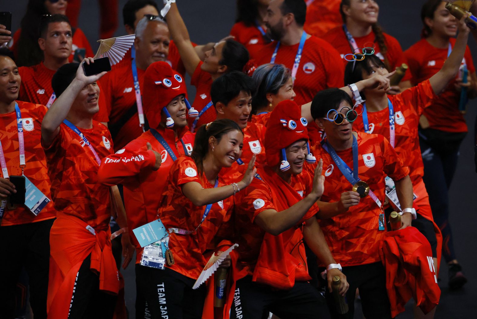 Japanese athletes participate in the parade.