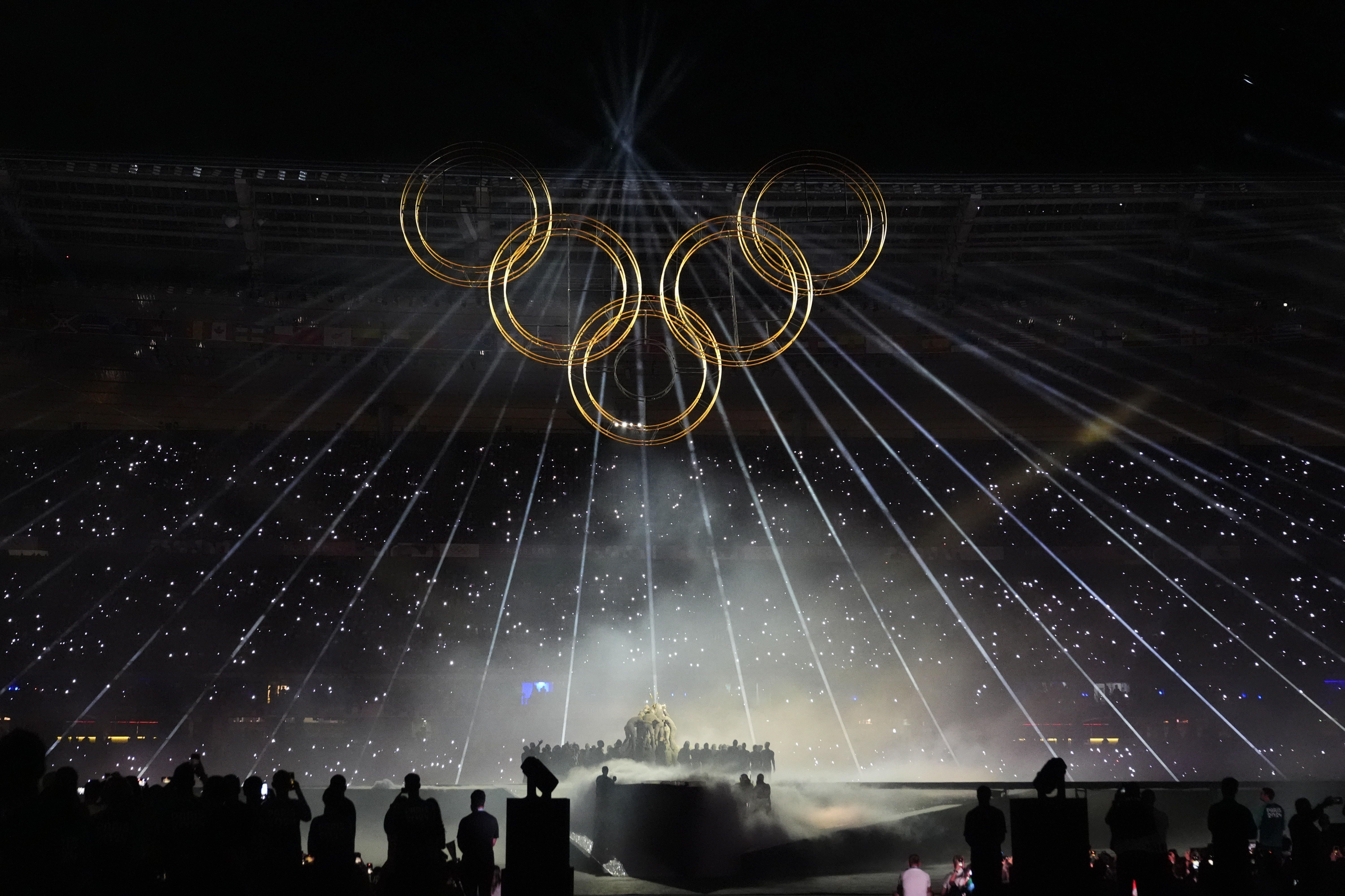 The Olympic rings are raised during the ceremony.