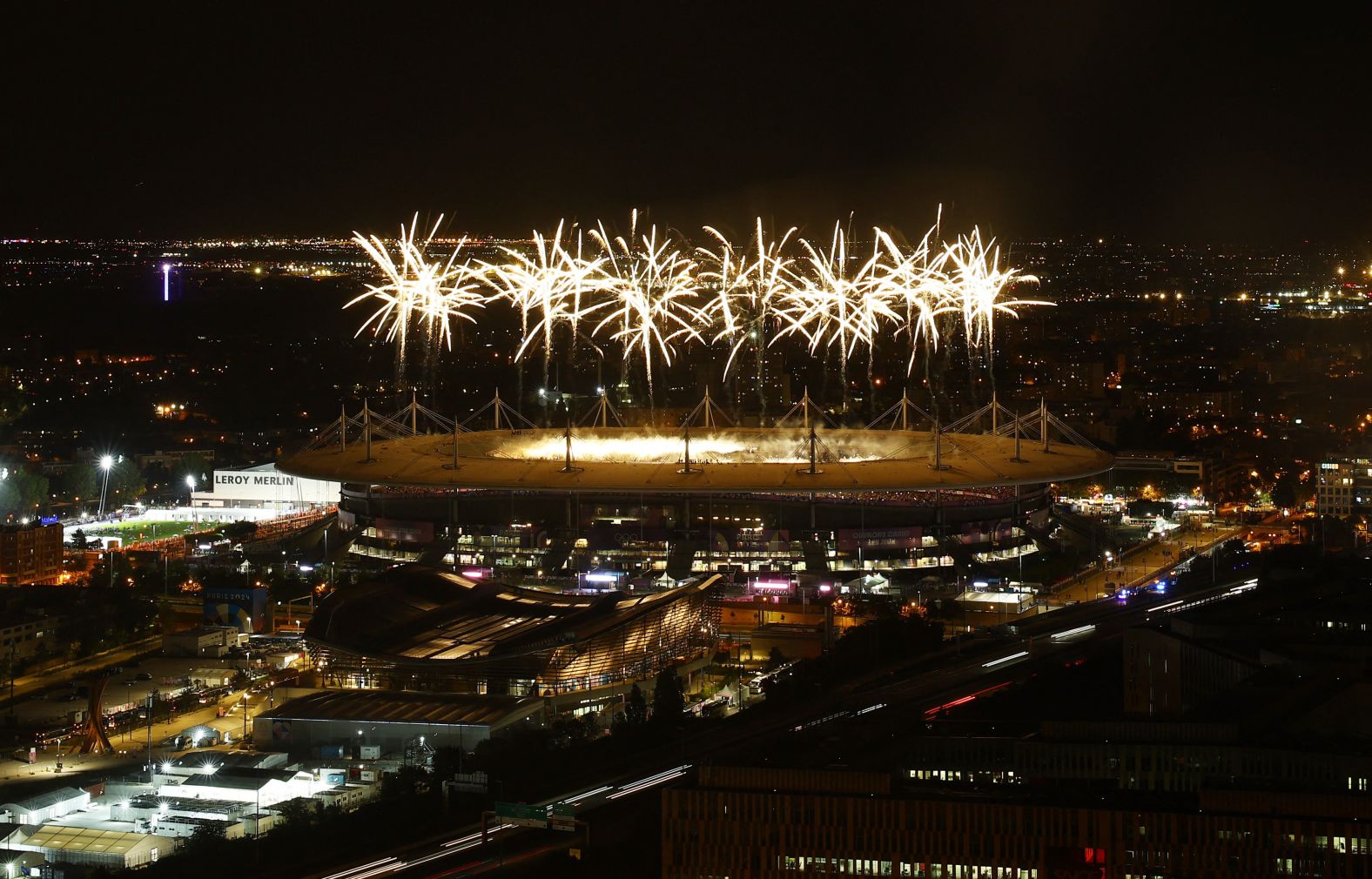 Fireworks explode above the Stade de France.