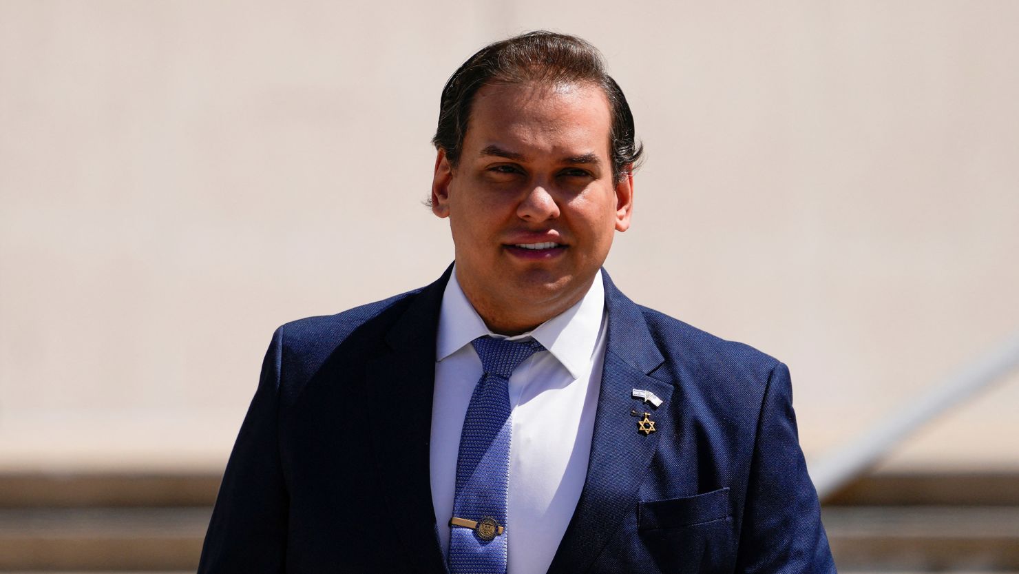 Former U.S. House Rep. George Santos departs federal court in Central Islip, New York, on August 13, 2024.