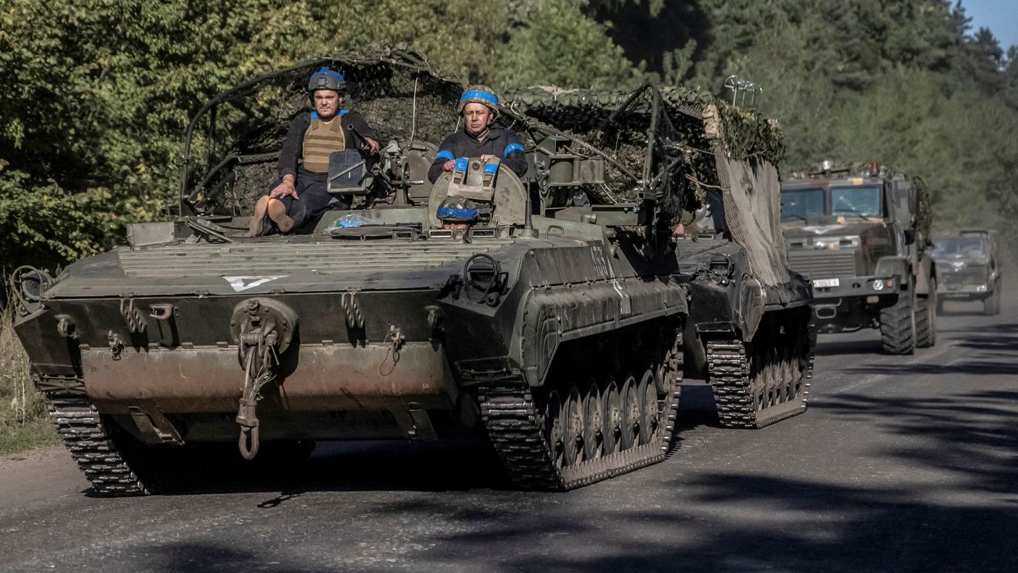 Ukrainian servicemen ride an armoured personnel carrier, near the Russian border in Sumy region, Ukraine, on Wednesday.