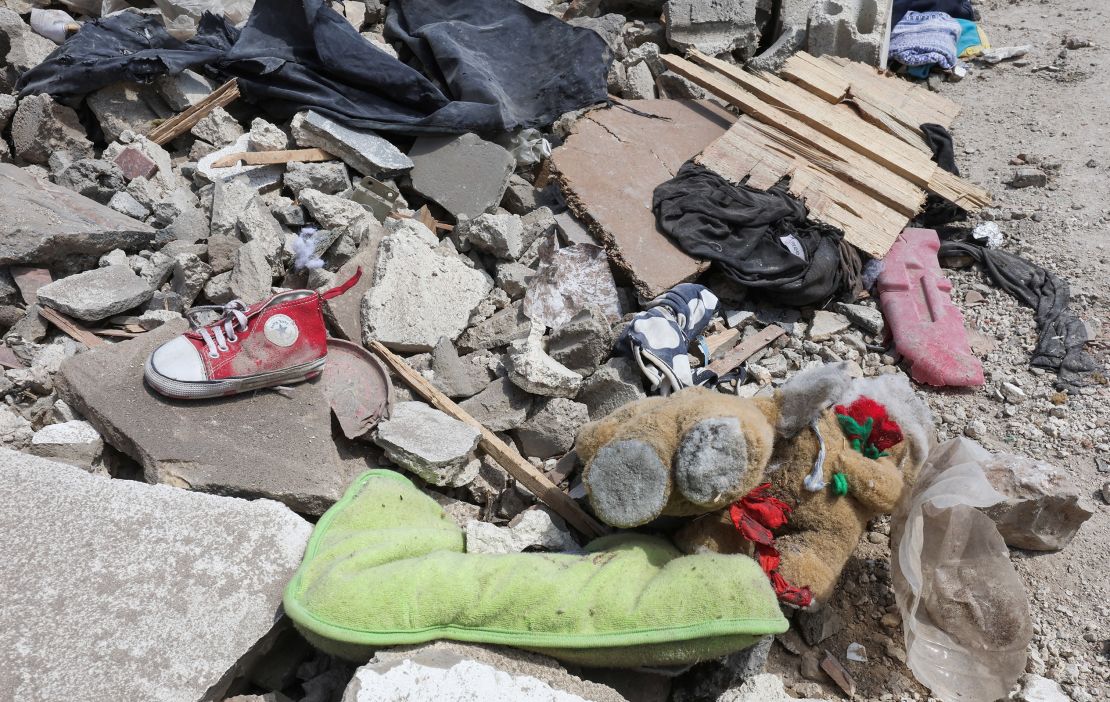 A shoe and a teddy bear seen in the rubble in the aftermath of the Nabatiyeh strike.