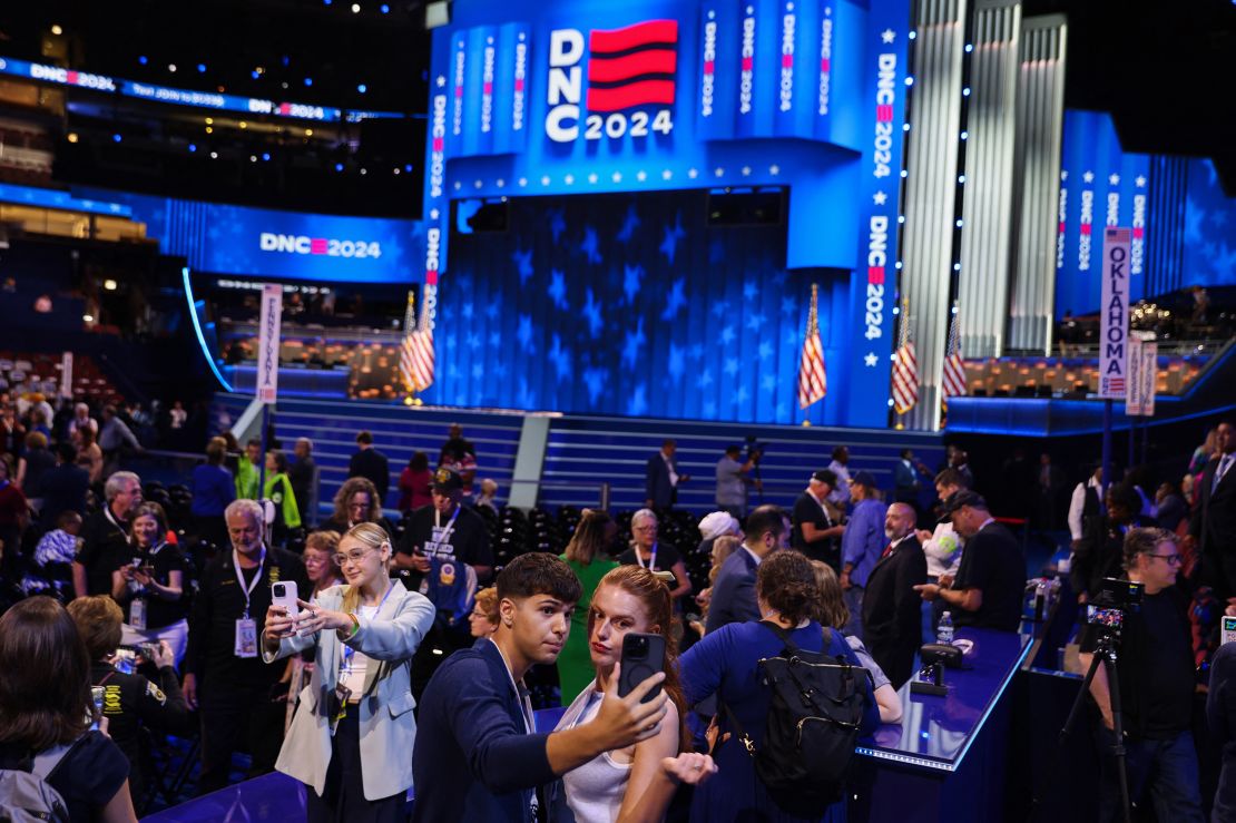 Influencers pose near the social media area of the venue at the Democratic National Convention in Chicago on August 20, 2024.